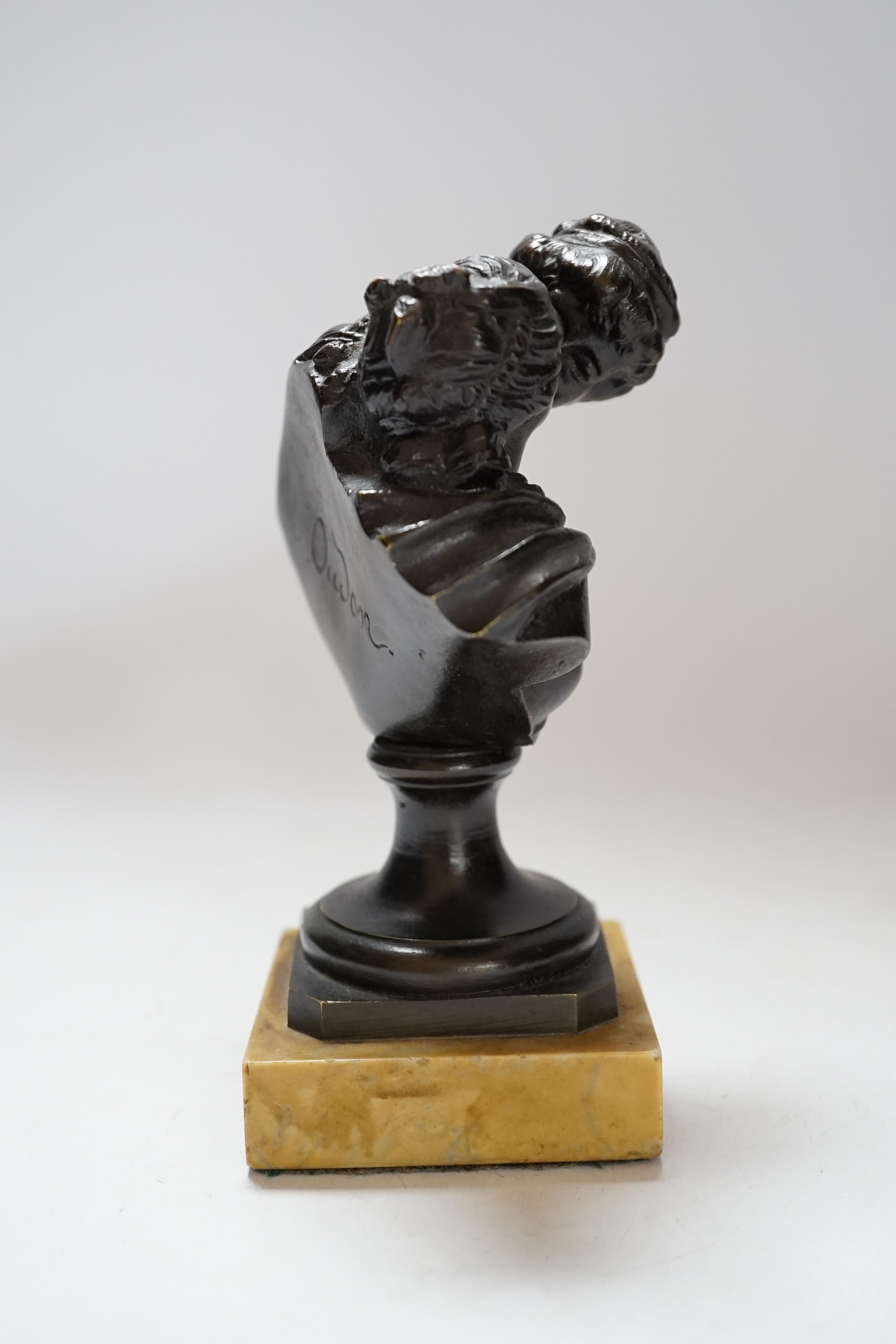 After Jean-Antoine Houdon (1741-1828), a bronze group, 'Le Baiser Donne' [‘The Kiss Bestowed’] on marble base, 16cm high